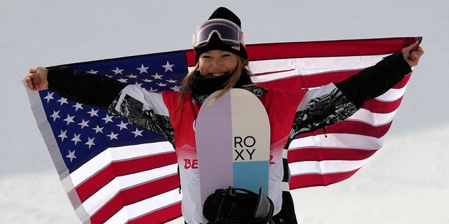 FILE - United States' Chloe Kim celebrates during the venue ceremony for the women's halfpipe at the 2022 Winter Olympics, Thursday, Feb. 10, 2022, in Zhangjiakou, China.